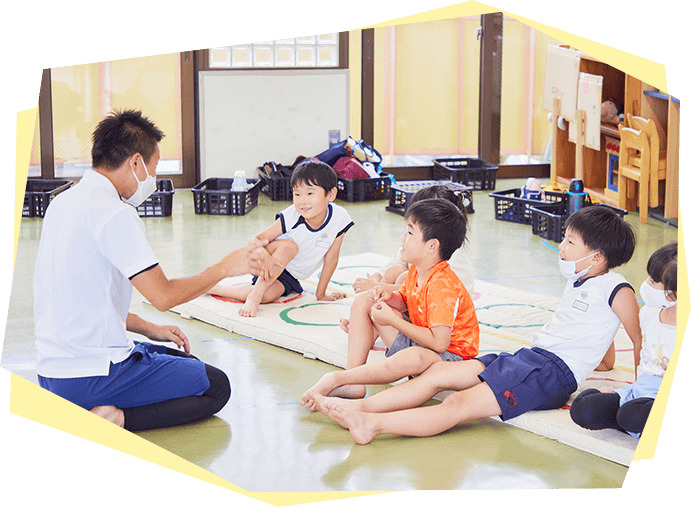 指導する先生と子供たち